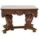 A Continental Renaissance Revival Carved Oak Center Table, Late 19th Century