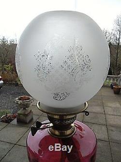 A Very Nice Cranberry Late Victorian Twin Duplex Table Oil Lamp