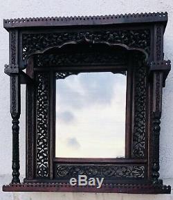 Antique Anglo Indian heavily carved Hanging Shelf and Mirror late 19th century