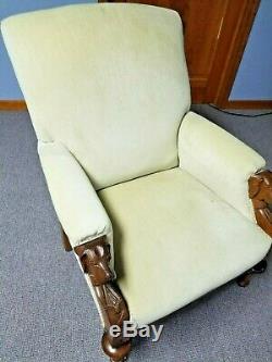 Antique Walnut Upholstered Easy Chair with carved dog head arms, circa late1800s