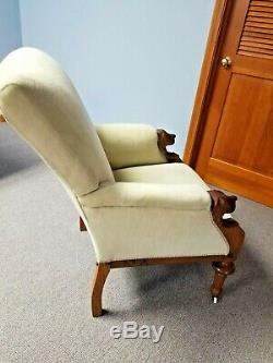 Antique Walnut Upholstered Easy Chair with carved dog head arms, circa late1800s