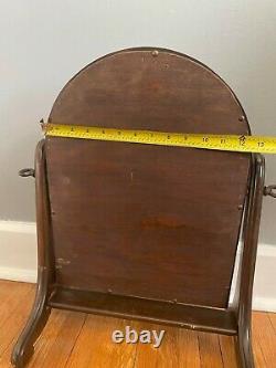 Arched wooden vanity mirror with holder, late Victorian freestanding