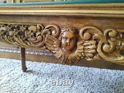 Carved and gilded wood table with putti, marquetry, late 19th century