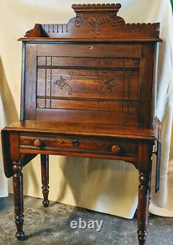 Eastlake style, mid to late 19th century, drop front walnut desk with chair