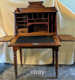 Eastlake style, mid to late 19th century, drop front walnut desk with chair