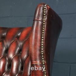 LATE 20th CENTURY PAIR OF ENGLISH LEATHER BARREL BACK ARMCHAIRS