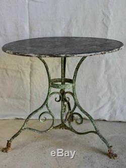 Late 19th Century round Arras garden table with claw feet 32