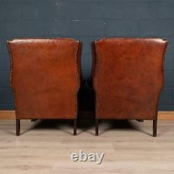 PAIR OF LATE 20thC ENGLISH SHEEPSKIN LEATHER WINGBACK ARMCHAIRS