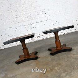 Pair Late 20th Baker Furn Campaign Style Black & Natural Pedestal End Tables