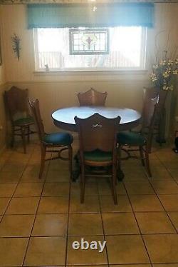 Used Antique Round Oak Claw Foot Dining Table 42 in. With 2 leaves and 6 chairs